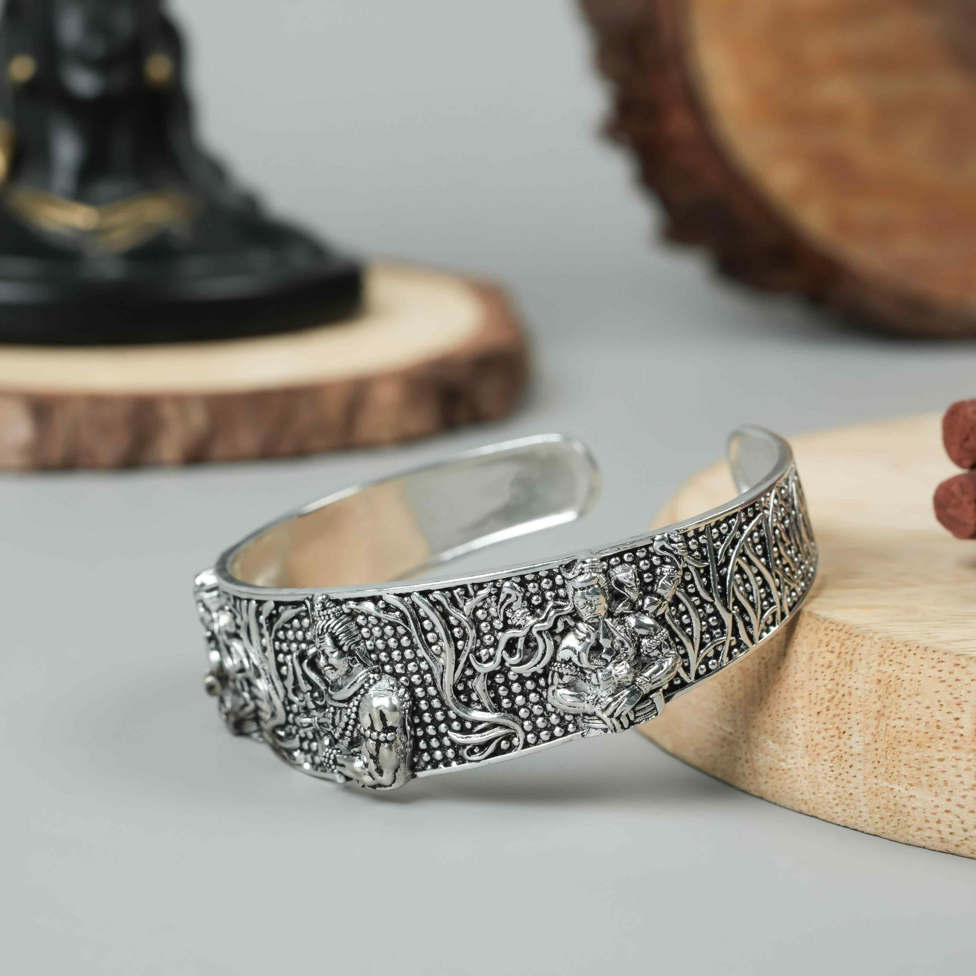 This men's oxidised silver Mahakal bracelet is a sophisticated and unique accessory. Crafted with expert precision and detailed design, it features a strong and masculine oxidised silver finish. Perfect for both casual and formal occasions, this bracelet adds a touch of edge and style to any outfit.