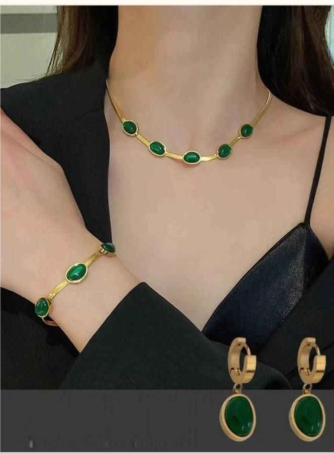 Expertly crafted, this Oval Green Crystal Pendant Necklace Set with Bracelet is a must-have accessory. Featuring a stunning green crystal pendant and matching bracelet, this set adds a touch of elegance to any outfit. Handmade with precision, this set is sure to make a statement.