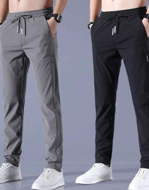 Introducing our Pack of 2 Men Straight Track Pants, perfect for any active, fashion-forward man. Made with high-quality materials, these track pants provide maximum comfort and flexibility for your workouts or everyday wear. Stay stylish and comfortable all day long with this pack of two.