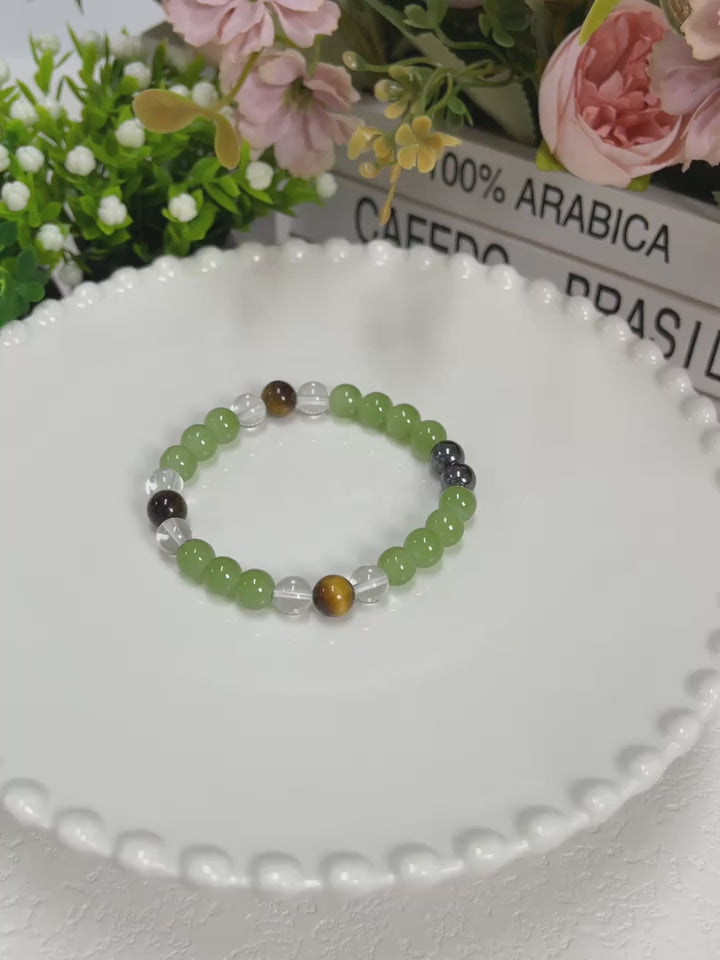 Tiger's Eye Stone and Crystal Beads Bracelet Pack of 1
Elevate your accessory collection with this sophisticated Tiger's Eye Stone and Crystal Beads Bracelet. Featuring the distinctive golden-brown chatoyancy of genuine Tiger's Eye gemstones complemented by sparkling crystal beads, this bracelet combines natural protection properties with elegant style. The carefully balanced composition offers versatile wear for both casual and formal occasions.