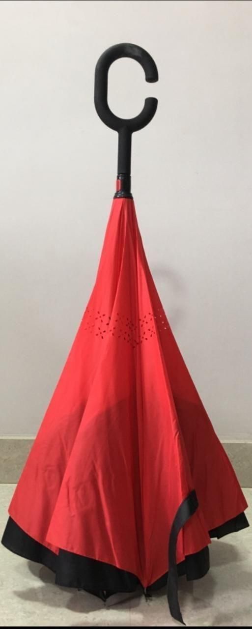 The Double Layer Inverted Reversible Umbrella features a unique design that folds inward, preventing water from dripping when closed. Its double-layer construction enhances durability and wind resistance, while the reversible mechanism allows easy entry and exit from vehicles or doorways without getting wet. The multicolor pattern adds a stylish touch, making it both functional and visually appealing for everyday use. Ideal for those seeking reliable protection and convenience in unpredictable weather.