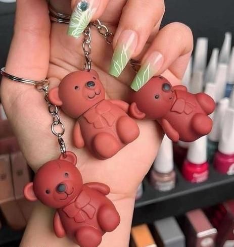 This innovative 2-in-1 Keychain Bear Matte Lipstick combines functionality with style, offering two assorted matte lipsticks in charming bear-shaped containers. The precision-formulated matte finish provides long-lasting color without excessive shine. Each compact unit attaches conveniently to keys or bags, ensuring your preferred shade is always accessible. The set includes two complementary colors, selected to enhance various skin tones and occasions.