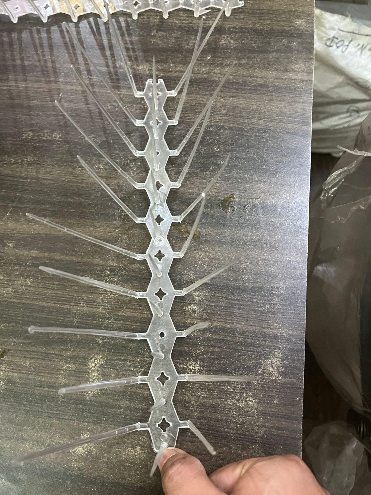 Professional-grade bird deterrent system featuring 10 interlocking polycarbonate spike strips. Designed with precise spacing to prevent nesting and perching without causing harm to birds. UV-resistant construction ensures longevity in all weather conditions. Ideal for ledges, signs, and architectural features where bird activity causes damage and unsanitary conditions. Includes mounting hardware for versatile installation options.