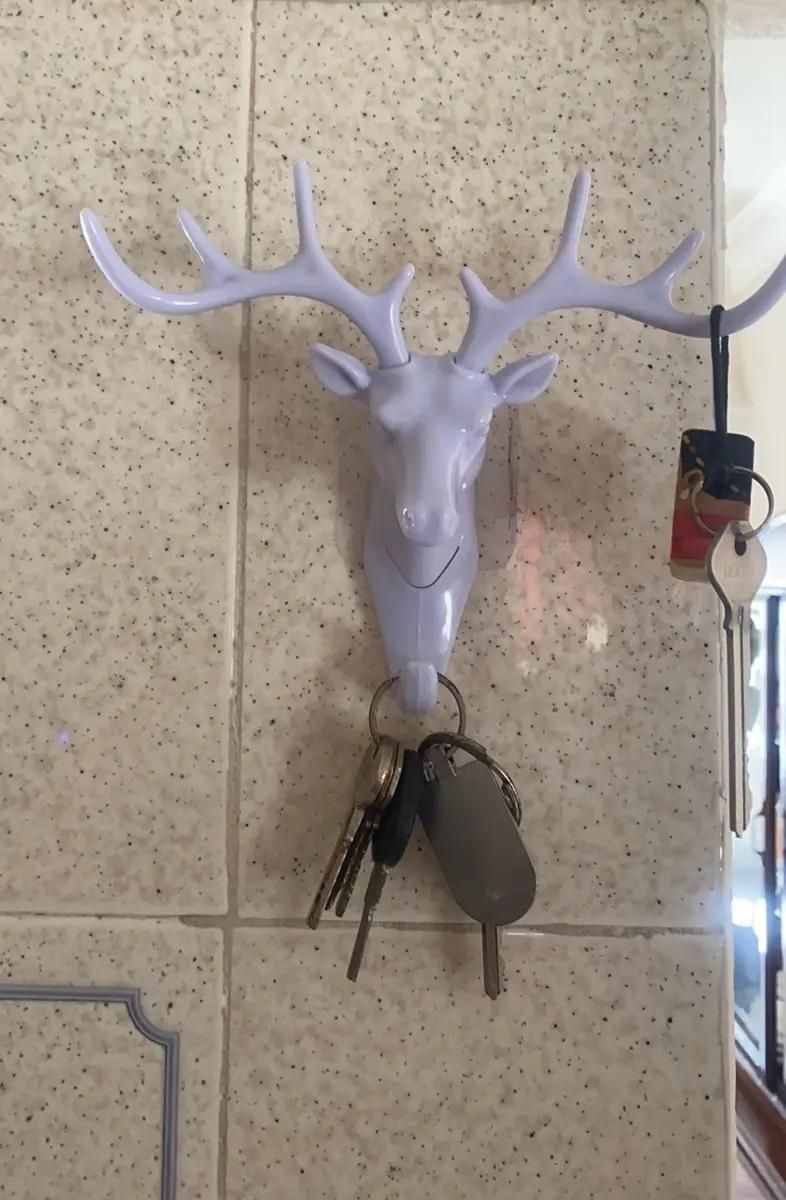 The Self Adhesive Deer Head Hanging Hook combines elegant design with practical functionality. Easy to install without drilling, this hook adheres securely to smooth surfaces, providing a reliable spot to hang keys, light bags, or decorative items. Its unique deer head shape adds a refined touch to any room, making it both a stylish and efficient organizational accessory. Ideal for enhancing your home or office space with minimal effort.