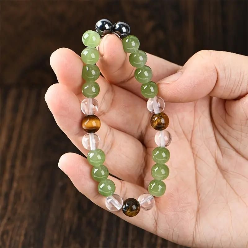 Tiger's Eye Stone and Crystal Beads Bracelet Pack of 1
Elevate your accessory collection with this sophisticated Tiger's Eye Stone and Crystal Beads Bracelet. Featuring the distinctive golden-brown chatoyancy of genuine Tiger's Eye gemstones complemented by sparkling crystal beads, this bracelet combines natural protection properties with elegant style. The carefully balanced composition offers versatile wear for both casual and formal occasions.