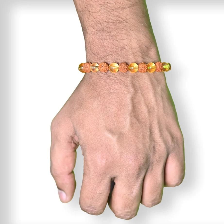 Rudraksha Citrine Crystal Bracelet (Pack of 2)

Harness the ancient power of Rudraksha beads combined with energy-enhancing Citrine crystals in this authentic bracelet set. Each pack contains two meticulously crafted bracelets designed to promote spiritual balance, prosperity, and positive energy flow. The natural variations in these sacred materials ensure each bracelet is uniquely yours, making them perfect for personal use or as meaningful gifts for those on a spiritual journey.