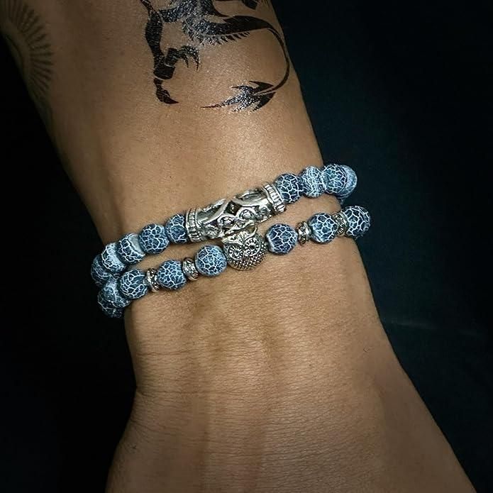 This beautiful Natural Stone Owl Bracelet is expertly crafted with high-quality natural stones that are believed to provide grounding and balance. The intricate owl design adds a touch of elegance while the stones provide potential healing and positive energy benefits. A perfect accessory for any outfit.