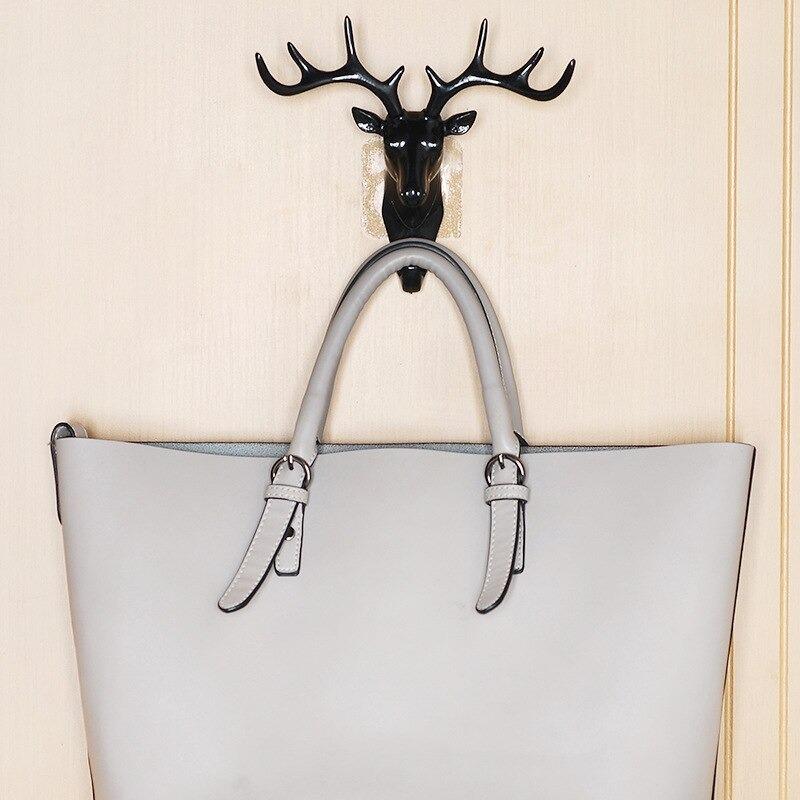 The Self Adhesive Deer Head Hanging Hook combines elegant design with practical functionality. Easy to install without drilling, this hook adheres securely to smooth surfaces, providing a reliable spot to hang keys, light bags, or decorative items. Its unique deer head shape adds a refined touch to any room, making it both a stylish and efficient organizational accessory. Ideal for enhancing your home or office space with minimal effort.