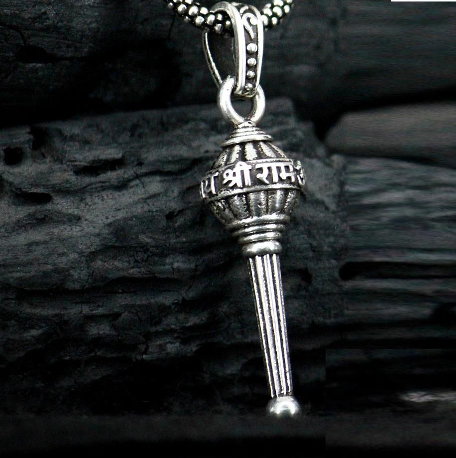This men's silver chain is adorned with a Gada pendant, adding a touch of uniqueness to any outfit. Made with high-quality silver, this chain is durable and stylish. Perfect for those who want to make a statement, while still maintaining a sophisticated look.