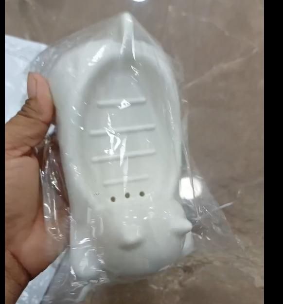 This Cat Shape Soap Holder combines functionality with feline-inspired design. Featuring strategic drainage holes to prevent water accumulation, it extends soap longevity by keeping it dry between uses. The elevated platform promotes airflow, reducing soap waste while adding a distinctive decorative element to your bathroom or kitchen space. Crafted from durable materials for long-term use in humid environments.