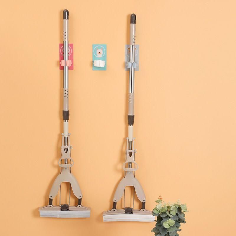 Keep your cleaning tools organized and easily accessible with this pack of 2 wall-mounted mop and broom holders. Designed with a playful cartoon style, these holders securely grip your mops and brooms, preventing clutter and saving floor space. Easy to install and durable, they provide a practical solution for maintaining a tidy and efficient cleaning area. Ideal for homes or workplaces seeking both functionality and a touch of fun in storage.