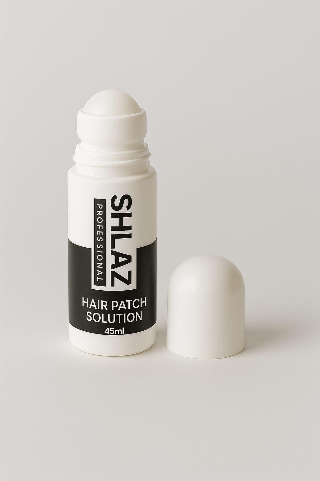 Shlaz Hair Patch Solution provides professional-grade adhesive performance in a precise 45ml application. Specifically engineered for hair systems, this specialized formula creates a secure bond that withstands daily activities while remaining discreet. The balanced composition ensures optimal hold without compromising scalp health, making it the preferred choice among hair replacement specialists.
