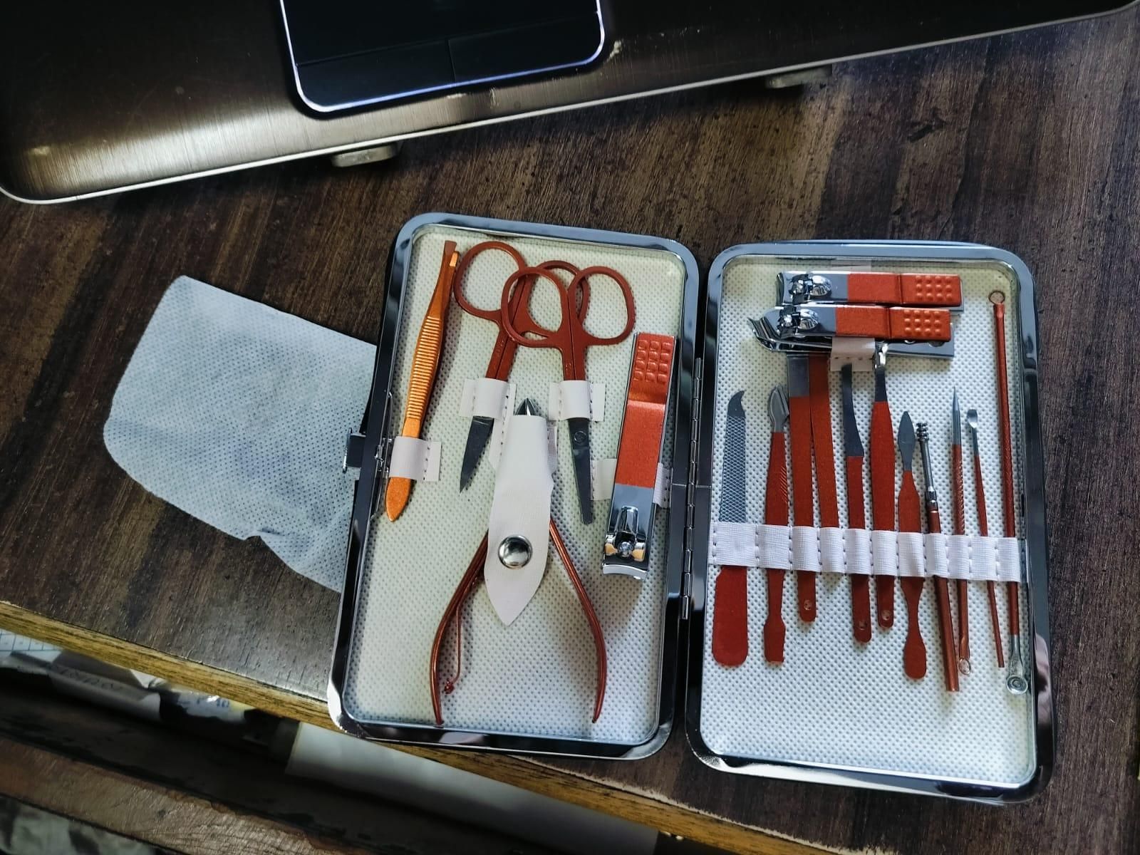 Professional-grade Manicure/Pedicure Nail Tool Set featuring precision-engineered stainless steel instruments for comprehensive nail maintenance. Each specialized tool addresses specific aspects of nail care, from cuticle management to precise shaping and buffing. The surgical-grade materials ensure optimal hygiene standards while providing exceptional durability and performance for both professional technicians and discerning home users.