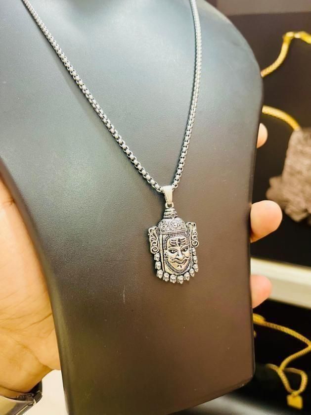 Silver Mahakal Pendant WIth Chain

Crafted with precision, this Silver Mahakal Pendant With Chain combines spiritual significance with elegant craftsmanship. The detailed Mahakal design showcases expert silverwork, making it both a meaningful religious symbol and a sophisticated accessory. Comes complete with a matching chain for immediate wear.