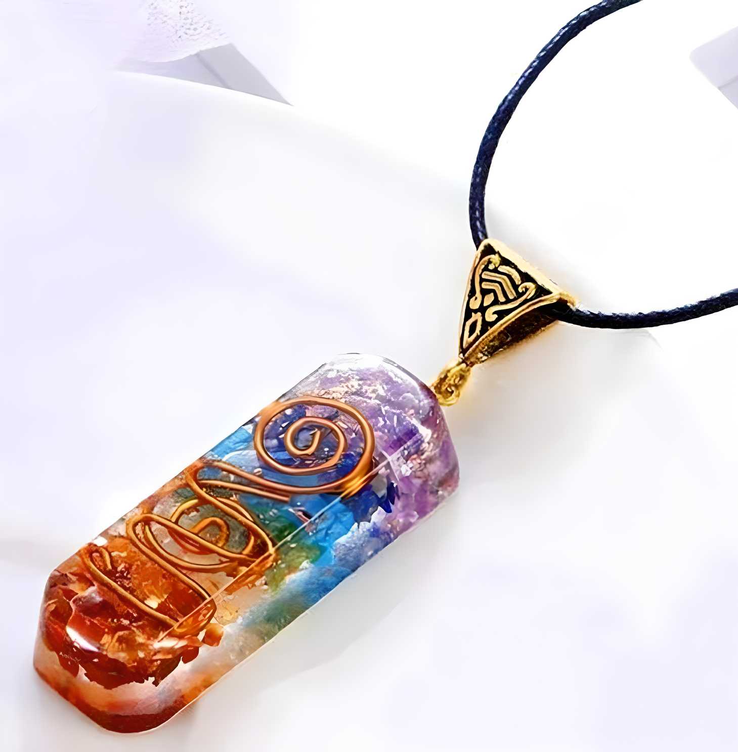 Titanium Quartz Stone Pendant features a naturally formed crystal with distinctive titanium-infused coloration. This high-quality pendant showcases the stone's unique metallic rainbow iridescence, created through a specialized vapor deposition process. Each piece displays one-of-a-kind patterns, making it both a striking jewelry statement and a powerful energy conductor for those interested in crystal properties.