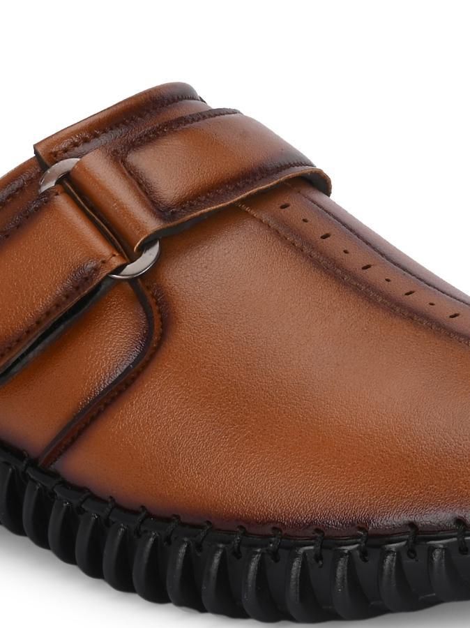 Effortlessly combine comfortable style and professional appeal with our Men's Bantu Style Tan Loafer Casual Shoe. With a classic loafer design and durable construction, these shoes offer the perfect balance of functionality and fashion. Perfect for any occasion, let these shoes elevate your wardrobe.