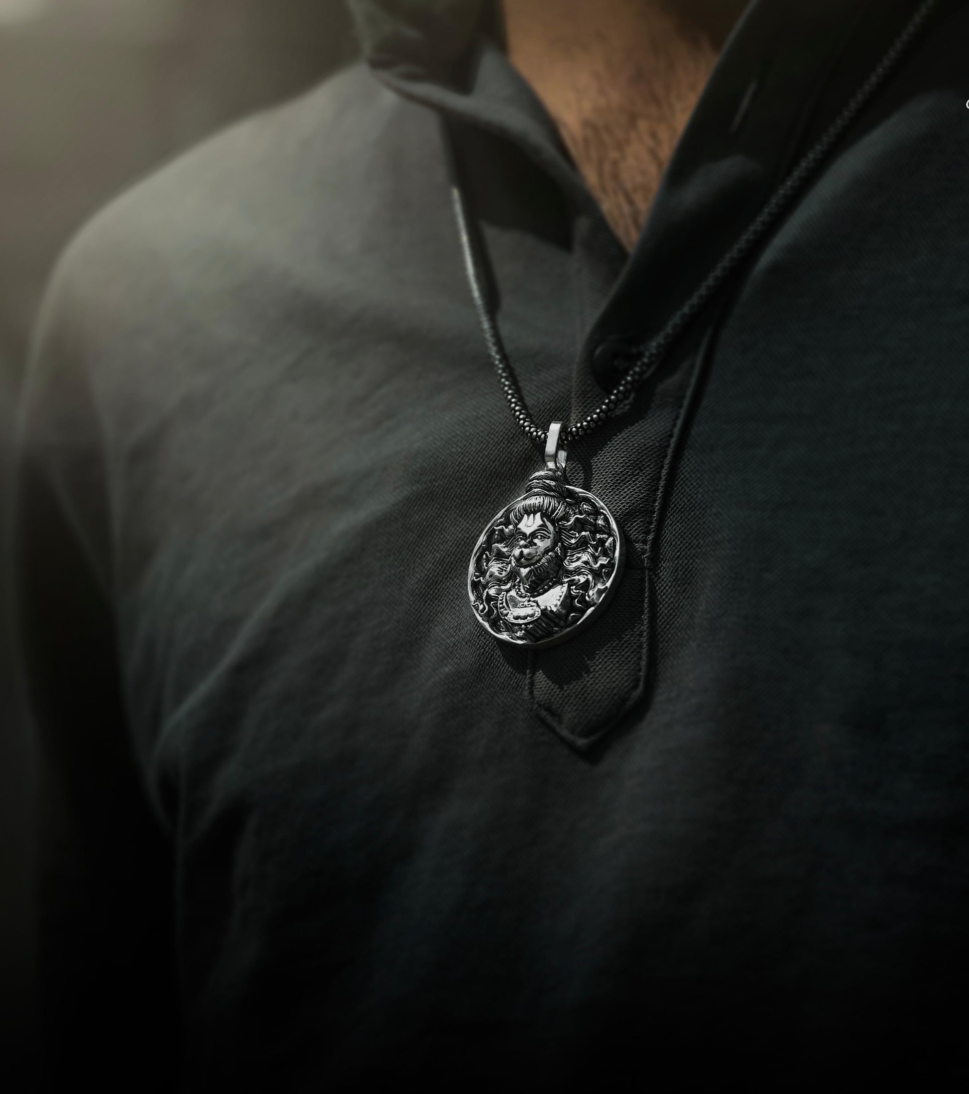 This men's silver chain features a stunning Hanuman pendant, adding a touch of spirituality and masculinity to your everyday look. The high-quality silver material ensures durability and a timeless appeal. Expertly crafted for the modern man, this chain is a must-have for any wardrobe.