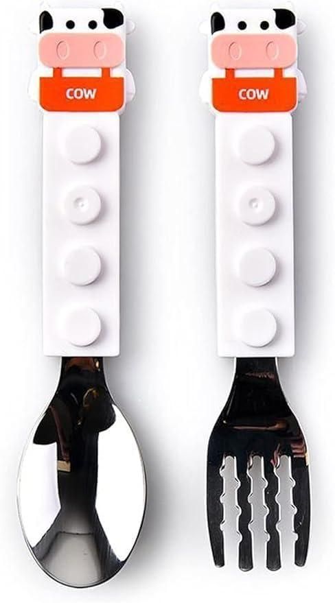 The Cow Shaped Grip Spoon and Fork set offers a unique blend of whimsical design and ergonomic functionality. Crafted to fit comfortably in hand, the cow-shaped handles provide a secure grip, enhancing control during use. Made from durable materials, this set is easy to clean and ideal for both children and adults seeking a practical yet charming dining experience. Perfect for everyday meals or as a distinctive gift.
