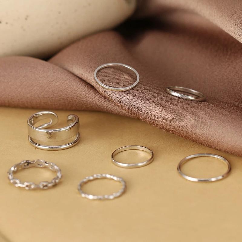 Silver Plated Trending Ring Set For Women (7 Pcs)

Elevate your accessory collection with this sophisticated 7-piece silver-plated ring set designed specifically for women. Each ring features contemporary styling that complements both casual and formal attire. The versatile set allows for multiple styling options—wear individually for subtle elegance or stack them together for a bold fashion statement. Crafted with quality plating for lasting shine and comfortable daily wear.