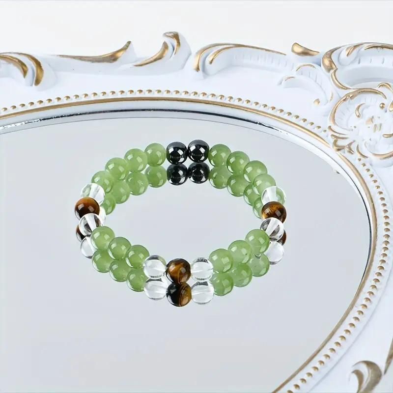 Tiger's Eye Stone and Crystal Beads Bracelet Pack of 1
Elevate your accessory collection with this sophisticated Tiger's Eye Stone and Crystal Beads Bracelet. Featuring the distinctive golden-brown chatoyancy of genuine Tiger's Eye gemstones complemented by sparkling crystal beads, this bracelet combines natural protection properties with elegant style. The carefully balanced composition offers versatile wear for both casual and formal occasions.