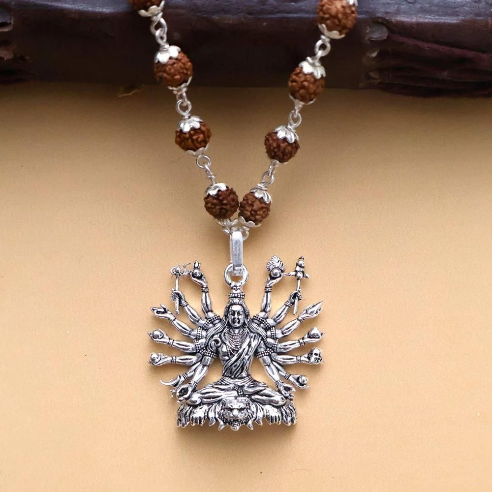 Sitted Shiva Embrace Silver Pendant

Meticulously crafted silver pendant depicting Lord Shiva in a seated posture. This elegant piece showcases intricate detailing of the deity's serene embrace, symbolizing protection and spiritual balance. The pendant's fine artisanship highlights traditional motifs while offering a sophisticated accessory for both devotional significance and aesthetic appeal.