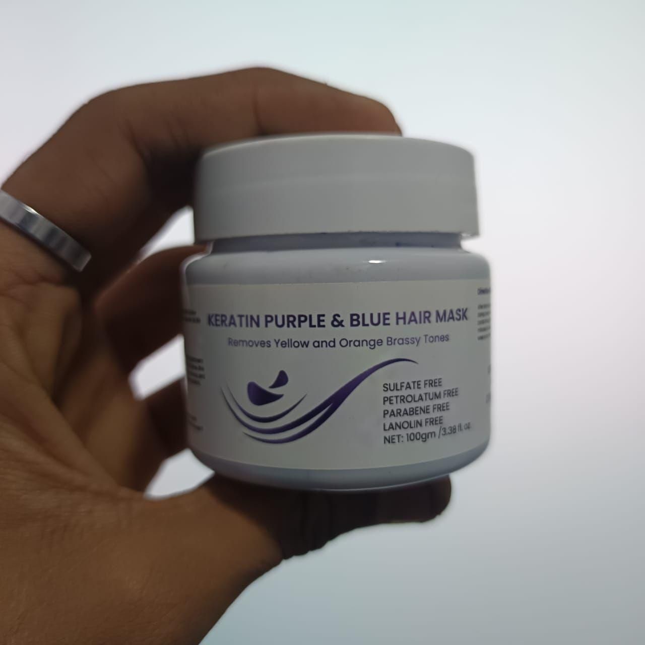 This professional-grade hair treatment combines two specialized formulations in one convenient package. The Purple Mask effectively neutralizes yellow tones in blonde, silver, or highlighted hair, while the Blue Mask counteracts unwanted orange hues in brunette shades. Both are enriched with keratin protein to repair damaged hair structure, restore elasticity, and enhance shine. Each 100g container delivers multiple applications for salon-quality results at home.