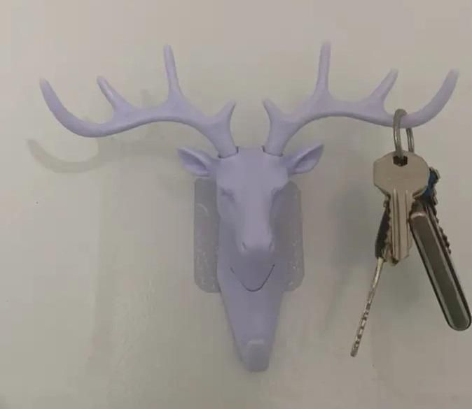 The Self Adhesive Deer Head Hanging Hook combines elegant design with practical functionality. Easy to install without drilling, this hook adheres securely to smooth surfaces, providing a reliable spot to hang keys, light bags, or decorative items. Its unique deer head shape adds a refined touch to any room, making it both a stylish and efficient organizational accessory. Ideal for enhancing your home or office space with minimal effort.