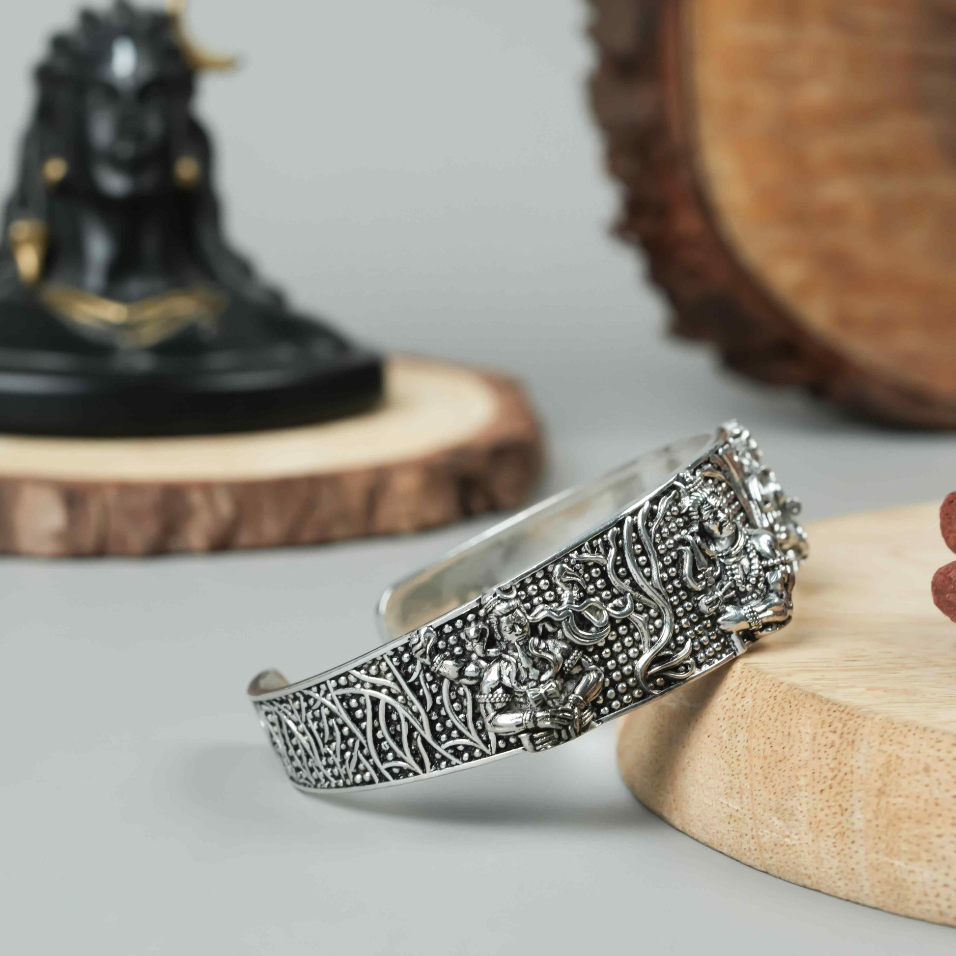 This men's oxidised silver Mahakal bracelet is a sophisticated and unique accessory. Crafted with expert precision and detailed design, it features a strong and masculine oxidised silver finish. Perfect for both casual and formal occasions, this bracelet adds a touch of edge and style to any outfit.