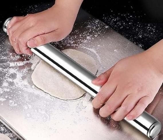 This professional-grade stainless steel rolling pin is engineered specifically for creating authentic chapatis, rotis, and flatbreads. Its balanced weight distribution and smooth surface ensure uniform dough thickness without sticking. The hygienic, non-porous material prevents bacterial growth while resisting corrosion, making it an essential tool for both home cooks and culinary professionals seeking consistent results.
