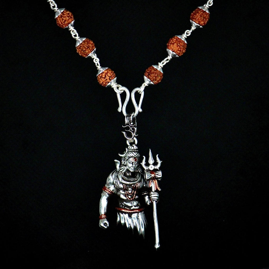 Rudraksha Shivji Pendant With Chain

Authentic Rudraksha Shivji Pendant with Chain combines spiritual significance with elegant design. The sacred Rudraksha bead, known for its protective properties, is paired with a meticulously crafted Shivji motif. This pendant serves as both a meaningful religious symbol and a distinguished accessory, offering wearers a connection to ancient Vedic traditions while enhancing their attire with timeless sophistication.