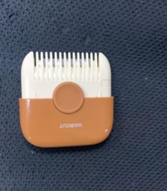 This innovative Two In One Hair Clipper And Hair Comb delivers professional-grade trimming capabilities in a compact, portable design. The dual-function tool features precision cutting blades integrated with a styling comb for consistent, accurate results. Engineered for versatility, it allows for detailed grooming with minimal effort, making it ideal for maintaining haircuts between salon visits or for complete at-home styling solutions.