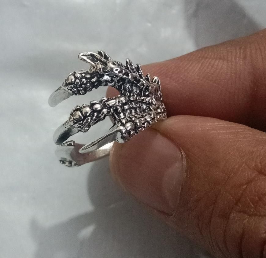 Silver Adjustable Dragon Ring (Pack of 2)

Precision-crafted adjustable dragon rings in sterling silver, sold as a set of two. These versatile accessories feature intricate dragon motifs with detailed scale patterns and gemstone accents. The adjustable band ensures comfortable fit for various finger sizes, making them ideal for dragon enthusiasts and fantasy-inspired fashion collections.