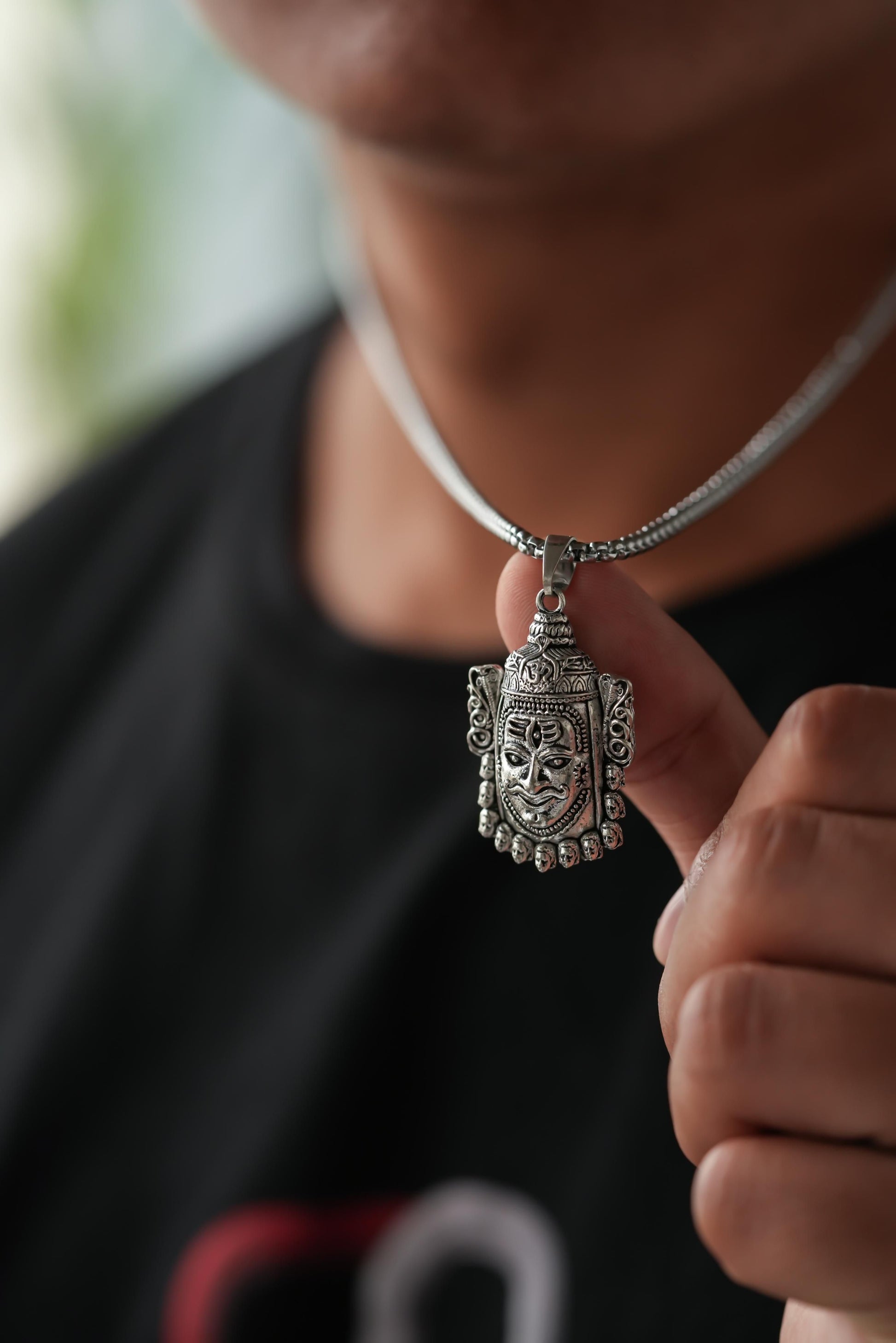 Silver Mahakal Pendant WIth Chain

Crafted with precision, this Silver Mahakal Pendant With Chain combines spiritual significance with elegant craftsmanship. The detailed Mahakal design showcases expert silverwork, making it both a meaningful religious symbol and a sophisticated accessory. Comes complete with a matching chain for immediate wear.