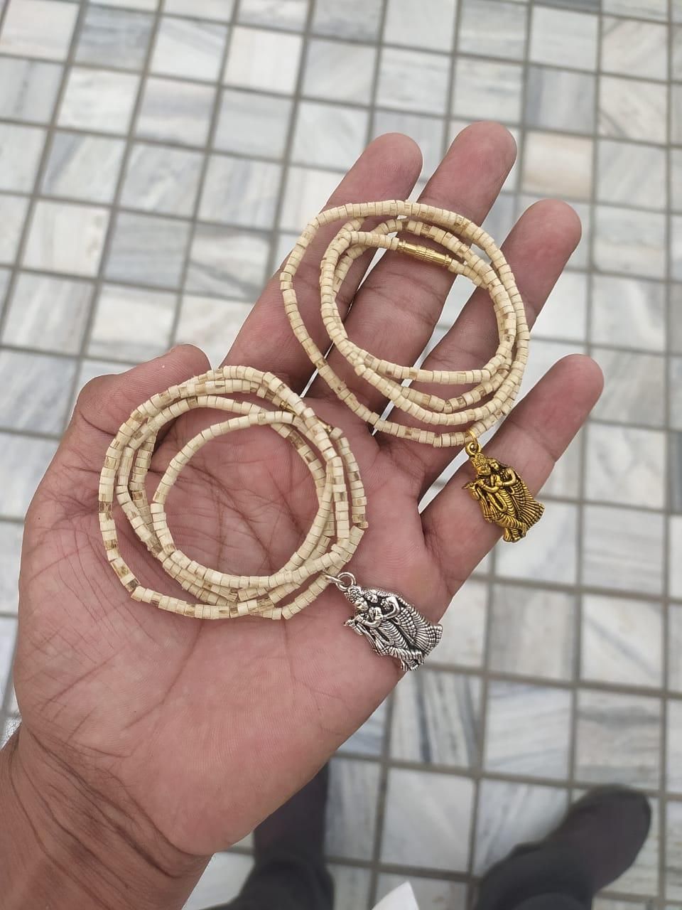 Experience the spiritual essence of Vrindavan with this authentic Tulsi Mala set. Each pack contains two meticulously crafted malas featuring sacred Tulsi beads complemented by elegant pendants. Traditionally used for meditation and prayer, these malas offer both religious significance and natural beauty, connecting wearers to centuries of devotional practice.