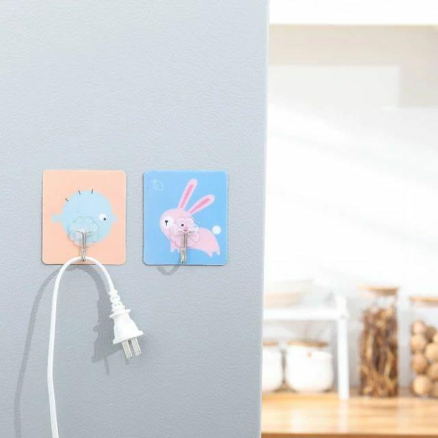 These Hooks-Cartoons Strong Adhesive Wall Sticky Hooks come in a pack of four, designed for reliable and damage-free mounting. Their strong adhesive backing ensures secure attachment to various surfaces, making them ideal for organizing and decorating your space efficiently. Easy to install and remove, these hooks provide a practical solution for hanging lightweight items without drilling or tools. Perfect for both home and office use, they combine functionality with a playful cartoon design to add a touch 