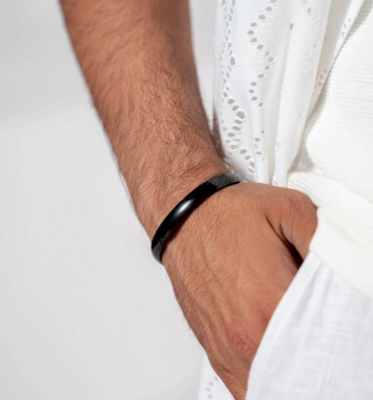 Precision-crafted stainless steel kada bracelet designed specifically for men seeking durability with style. This corrosion-resistant accessory maintains its luster through daily wear while providing a substantial yet comfortable fit. The classic kada design offers a sophisticated statement piece that transitions seamlessly from casual to formal occasions.