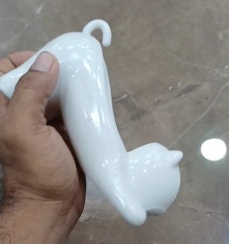 This Cat Shape Soap Holder combines functionality with feline-inspired design. Featuring strategic drainage holes to prevent water accumulation, it extends soap longevity by keeping it dry between uses. The elevated platform promotes airflow, reducing soap waste while adding a distinctive decorative element to your bathroom or kitchen space. Crafted from durable materials for long-term use in humid environments.
