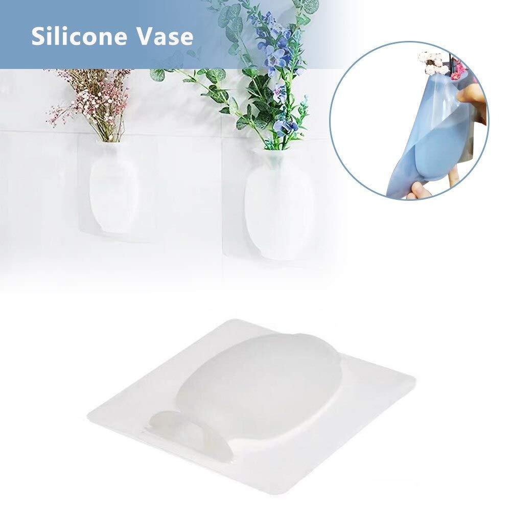 This wall-mounted silicone vase offers a versatile and modern solution for displaying flowers or small plants. Crafted from flexible, durable silicone, it adheres securely to smooth surfaces without the need for drilling or hardware. Its removable design allows easy repositioning and cleaning, making it ideal for enhancing any room with minimal effort. Perfect for adding a touch of greenery in compact spaces, this sticky vase combines functionality with sleek aesthetics for expert-level home decor.