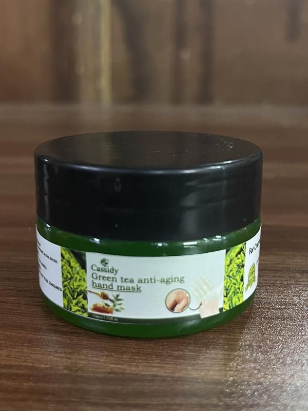 Revitalize aging hands with CASSIDY Green Tea Hand Mask, formulated with potent antioxidants to combat signs of aging. This professional-grade treatment penetrates deeply to hydrate, reduce fine lines, and restore elasticity. Each pack contains two 50gm masks, providing multiple applications for comprehensive hand rejuvenation. Regular use helps maintain youthful-looking hands while protecting against environmental damage.
