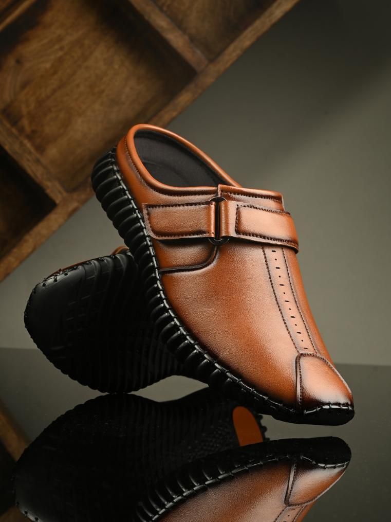 Effortlessly combine comfortable style and professional appeal with our Men's Bantu Style Tan Loafer Casual Shoe. With a classic loafer design and durable construction, these shoes offer the perfect balance of functionality and fashion. Perfect for any occasion, let these shoes elevate your wardrobe.