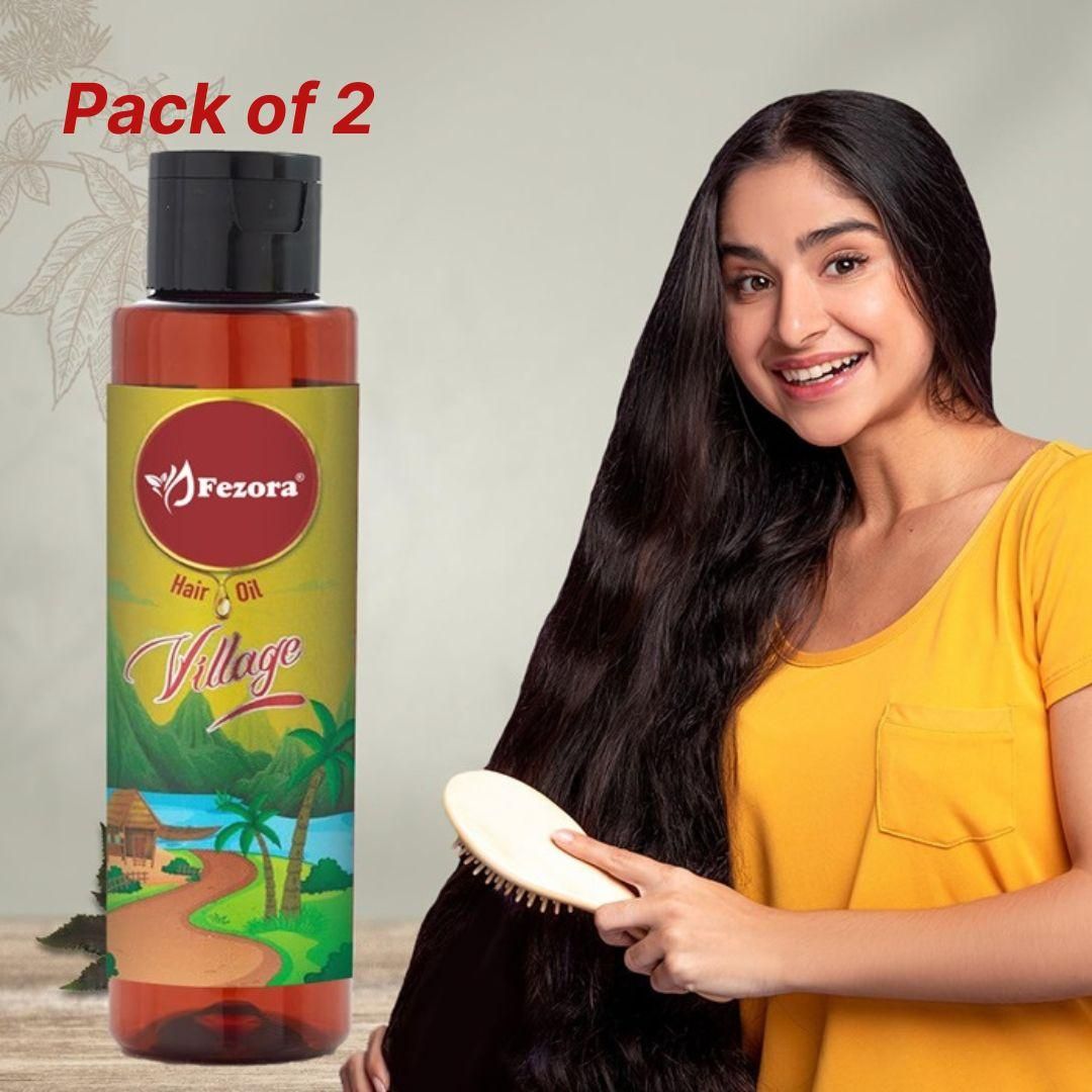 Fezora Village Hair Oil combines time-tested botanical extracts in a potent formula designed to address multiple hair concerns. This value pack of two 100ml bottles provides comprehensive hair care, targeting issues from the root to tip. The specialized blend penetrates deeply to strengthen follicles, restore moisture balance, and protect against environmental damage, resulting in visibly healthier, more manageable hair with continued use.