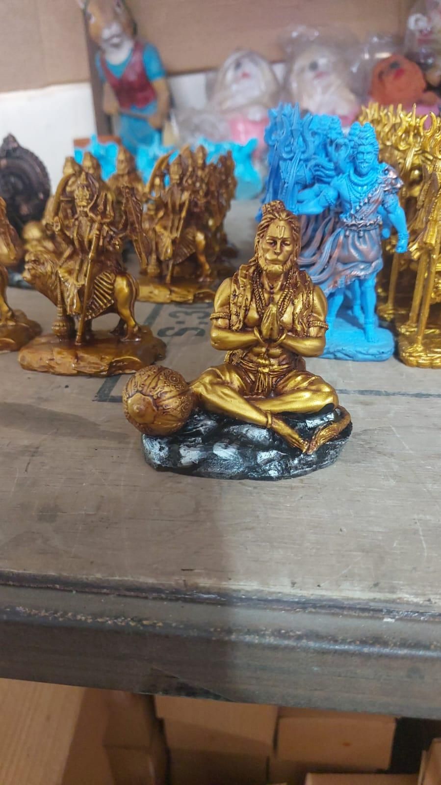This exquisitely detailed Mahabali Lord Hanuman Ji Statue represents the epitome of devotion and strength in Hindu iconography. Sculpted with precision to capture the divine essence of the Vanara god, it features traditional attributes including his powerful stance and benevolent expression. An authentic devotional piece that serves as both a spiritual focal point and an artistic masterpiece for worship spaces.