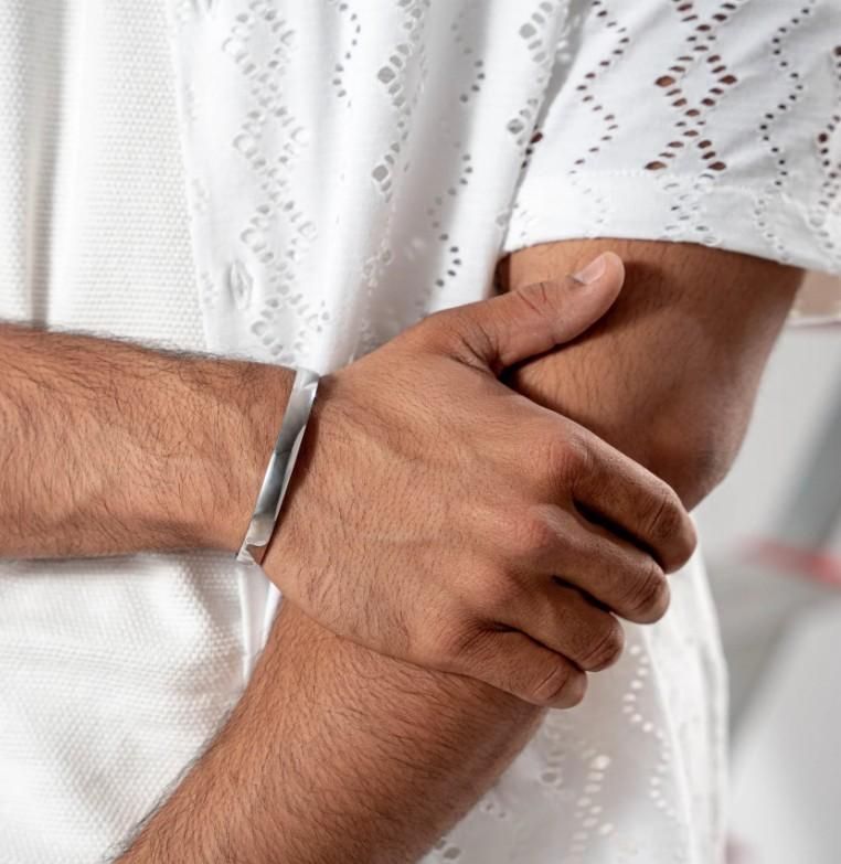 Precision-crafted stainless steel kada bracelet designed specifically for men seeking durability with style. This corrosion-resistant accessory maintains its luster through daily wear while providing a substantial yet comfortable fit. The classic kada design offers a sophisticated statement piece that transitions seamlessly from casual to formal occasions.
