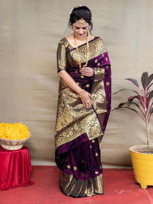 This Banarasi Silk Saree in a deep purple shade showcases exquisite woven craftsmanship over its 6.3-meter length. Made from premium silk, it offers a smooth texture and elegant drape, embodying traditional artistry with a refined finish. Ideal for formal occasions, this saree enhances your wardrobe with its rich heritage and sophisticated design.