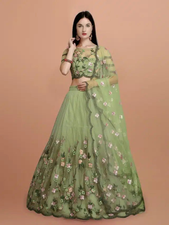 This green net embroidered semi-stitched lehenga choli combines intricate craftsmanship with versatile wearability. The delicate embroidery on lightweight net fabric enhances its aesthetic appeal while maintaining comfort. Its semi-stitched nature allows for tailored adjustments, ensuring a perfect fit for various body types. Ideal for festive occasions and celebrations, this ensemble offers a refined and elegant look with ease of customization.