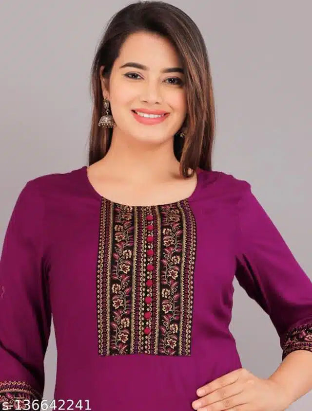 This purple rayon kurti features intricate embroidery, combining traditional craftsmanship with modern style. Designed for a comfortable fit in size XXS, it offers breathable fabric ideal for daily wear or festive occasions. Its elegant design enhances your wardrobe with a touch of sophistication and cultural charm.