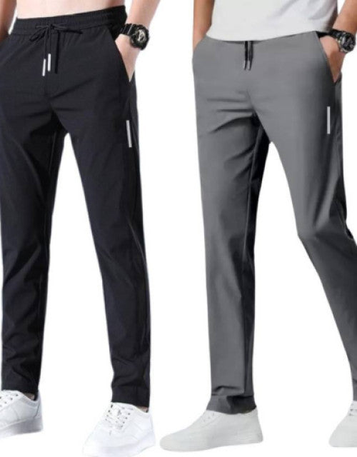 Stay comfortable and stylish with our Men Solid Black and Grey Track Pants. These track pants come in a pack of 2, perfect for your daily routine. Made with high-quality fabric, they offer superior comfort and durability. Upgrade your wardrobe with these versatile and practical track pants.