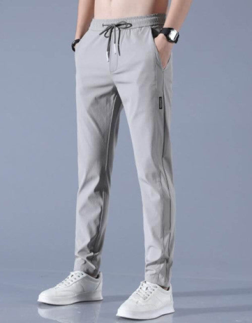 These Men Solid Grey Track Pants are a comfortable and stylish choice for any active man. Made from high-quality materials, these track pants offer a perfect fit and durability. With a solid grey color, they can easily match any workout top or loungewear. Stay comfortable and confident during your workouts with these track pants.