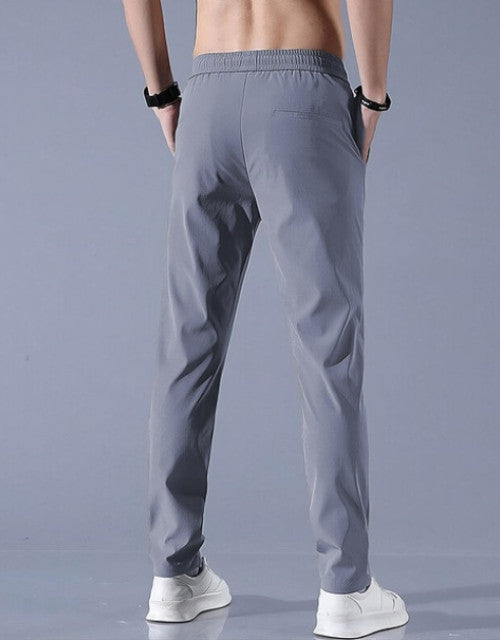 These Men Solid Grey Track Pants are a comfortable and stylish choice for any active man. Made from high-quality materials, these track pants offer a perfect fit and durability. With a solid grey color, they can easily match any workout top or loungewear. Stay comfortable and confident during your workouts with these track pants.