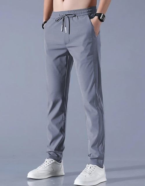 These Men Solid Grey Track Pants are a comfortable and stylish choice for any active man. Made from high-quality materials, these track pants offer a perfect fit and durability. With a solid grey color, they can easily match any workout top or loungewear. Stay comfortable and confident during your workouts with these track pants.